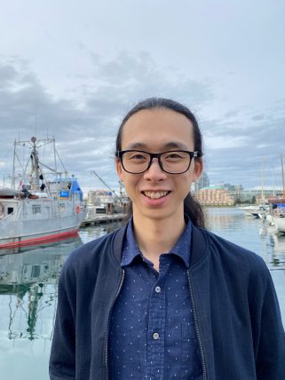 Photo of William Chen taken in a harbour.