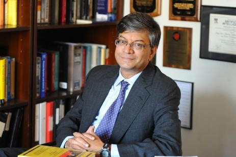 Venkat Venkatasubramanian seated in an office, smiling.